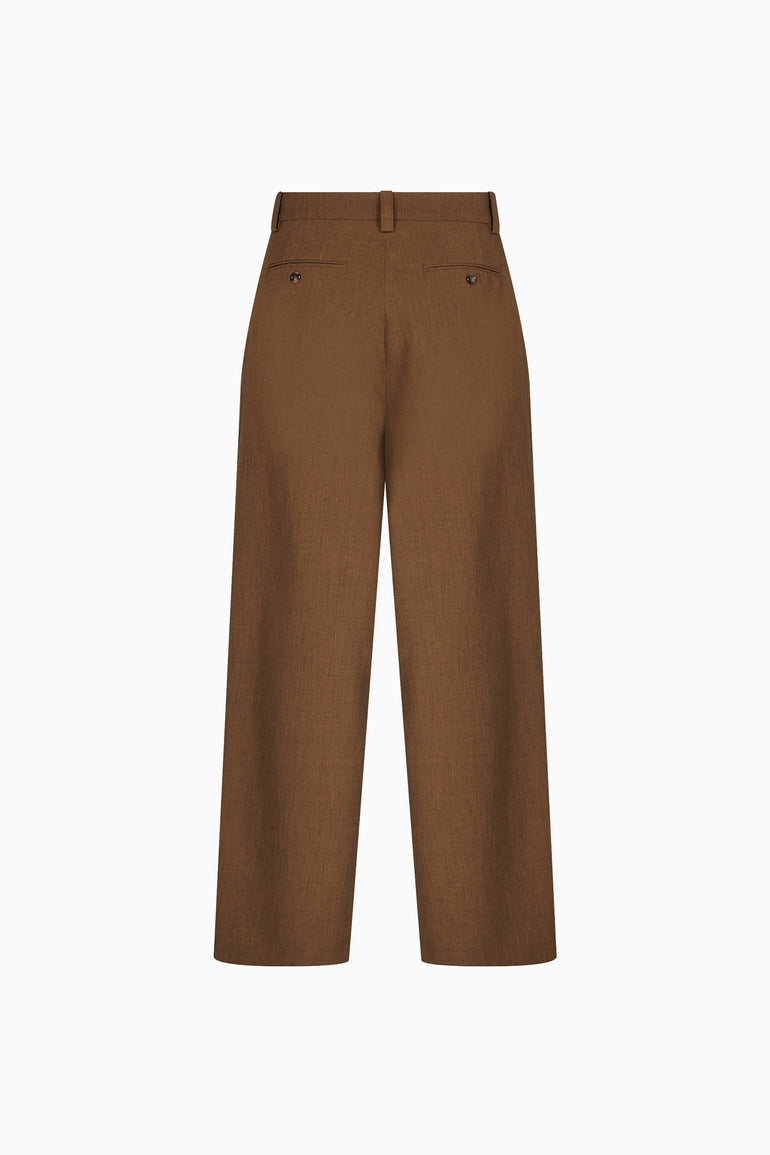 IH NOM UH NIT FW26 brown wide-leg flannel trousers with buttoned rear welt pockets, back view