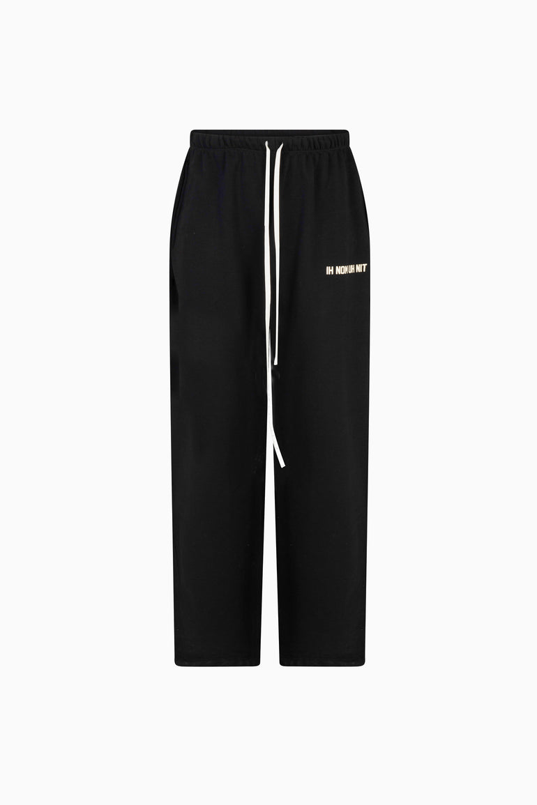 IH NOM UH NIT black wide-leg pants with oversized drawstrings and Athletics Division detail