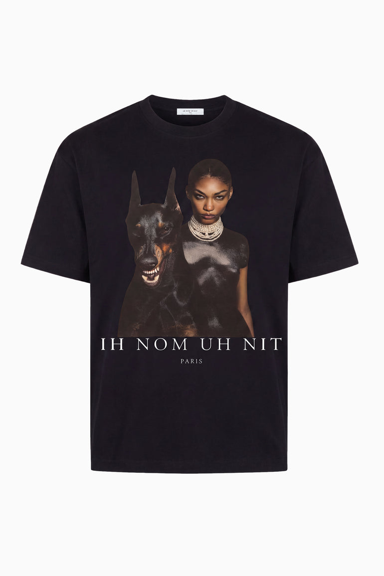 IH NOM UH NIT brown cotton T-shirt featuring the Family Print artwork with a Dobermann and editorial fashion portrait