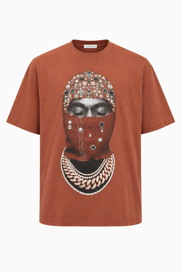 IH NOM UH NIT FW26 rust-brown cotton T-shirt with Mask Jewelry photographic print and applied crystals, decorative stones and pearl-like embellishments, front view.