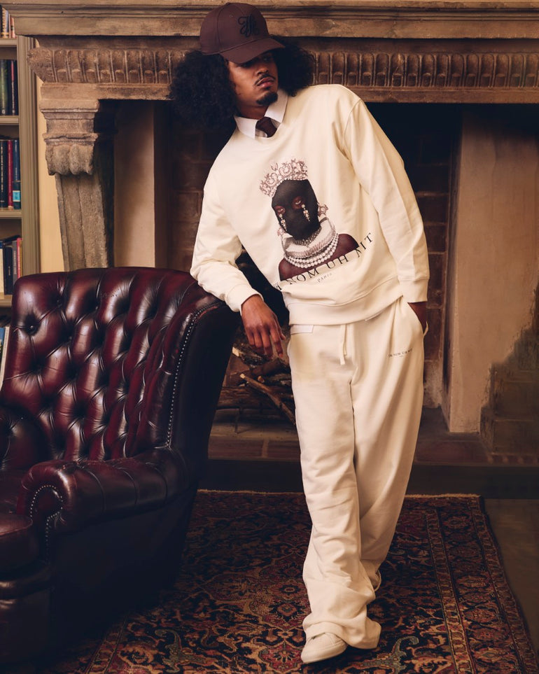 IH NOM UH NIT white cotton crewneck sweatshirt with Mask Queen photographic print, jeweled crown and jewelry imagery, front view.
