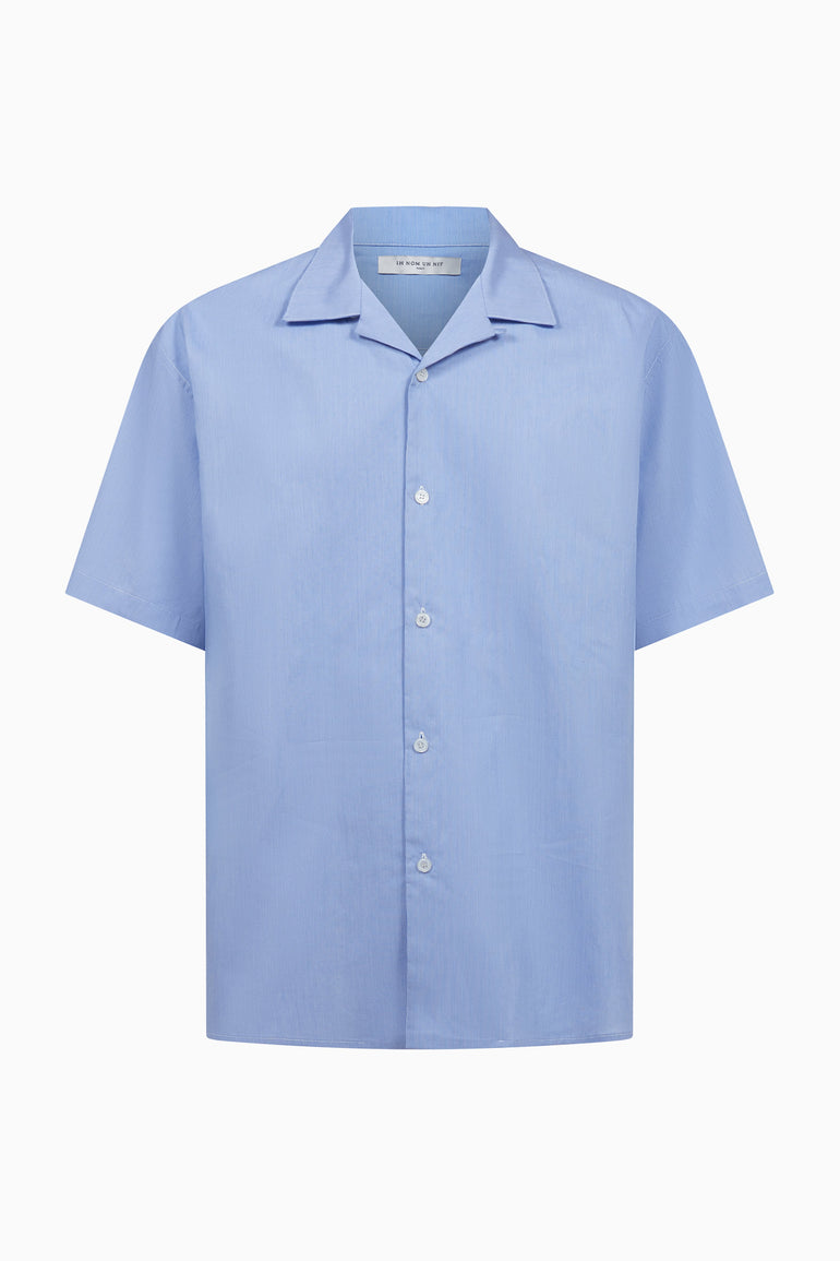 IH NOM UH NIT FW26 light blue cotton New Future Mask Bowling Shirt with open collar, front view