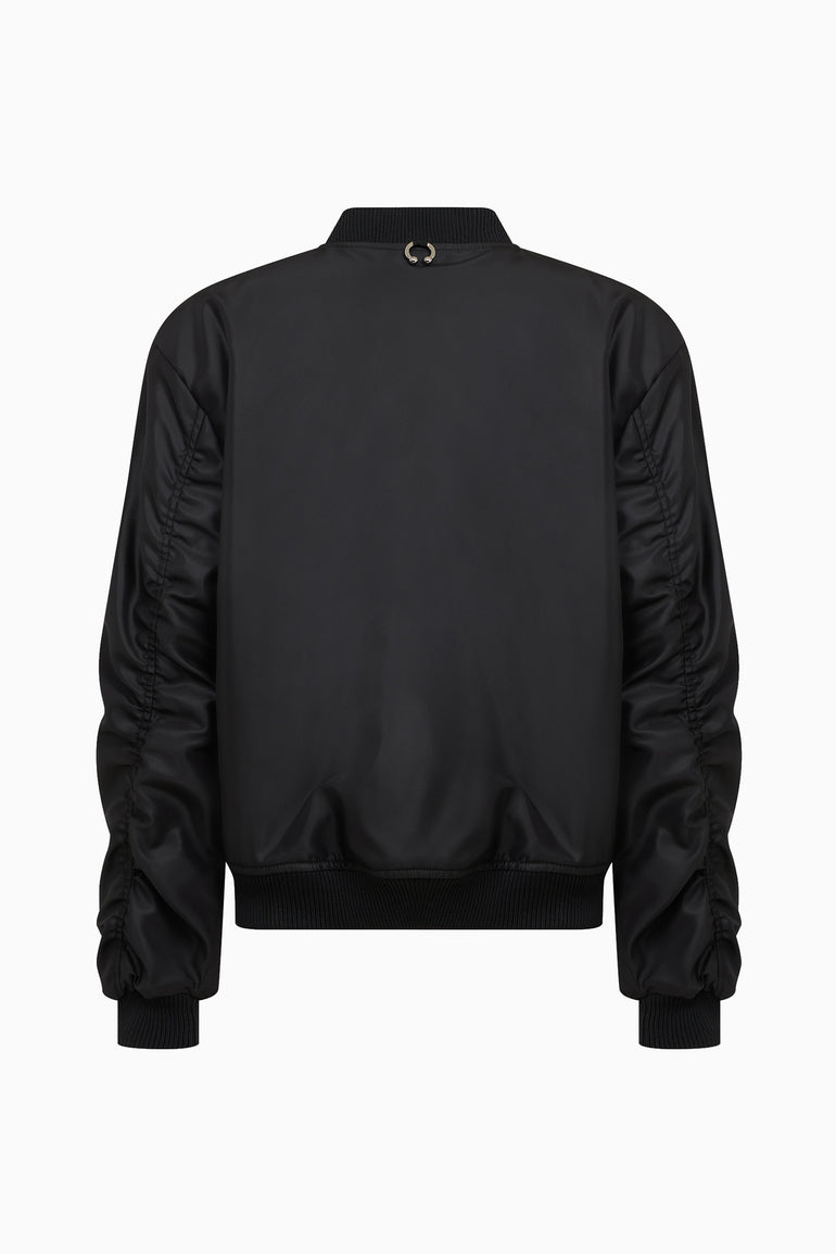 IH NOM UH NIT FW26 oversized black nylon bomber jacket with gathered sleeve detailing, back view