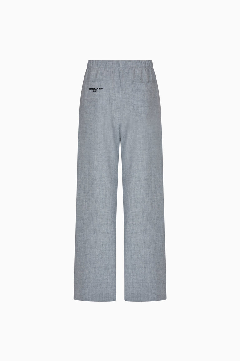 IH NOM UH NIT FW26 grey wide-leg flannel pants with rear patch pockets and small logo detail, back view